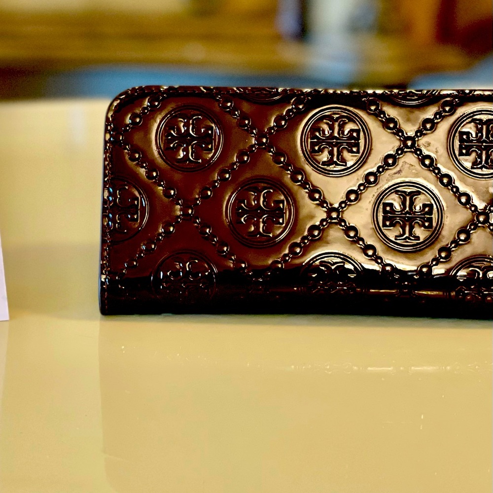 Tory Burch pre loved monogram embossed wallet